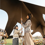 Covered gathering space beneath the Naturehike Cloud Skies Pro camping tarp